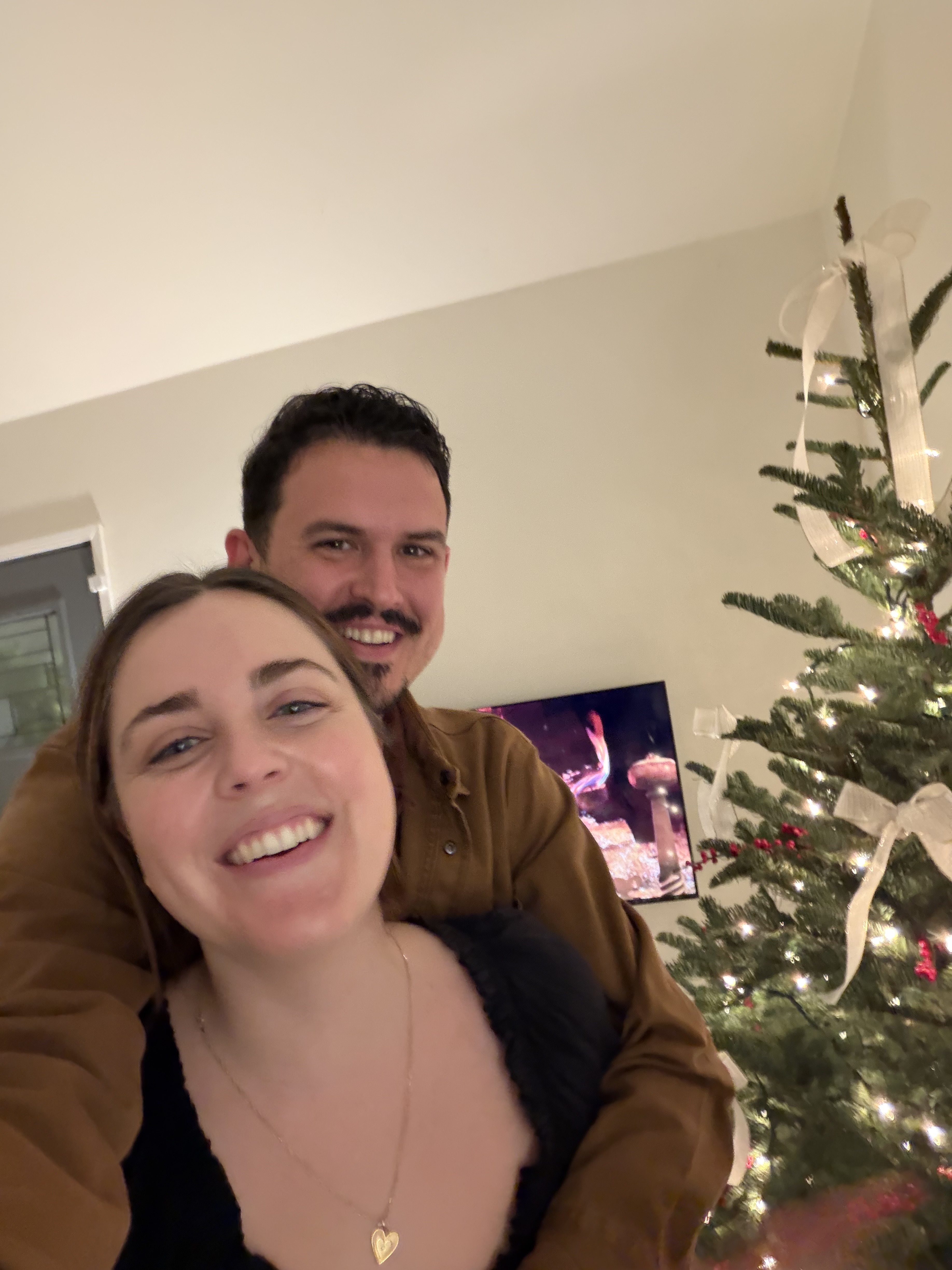 Ashley and Max by the Christmas tree